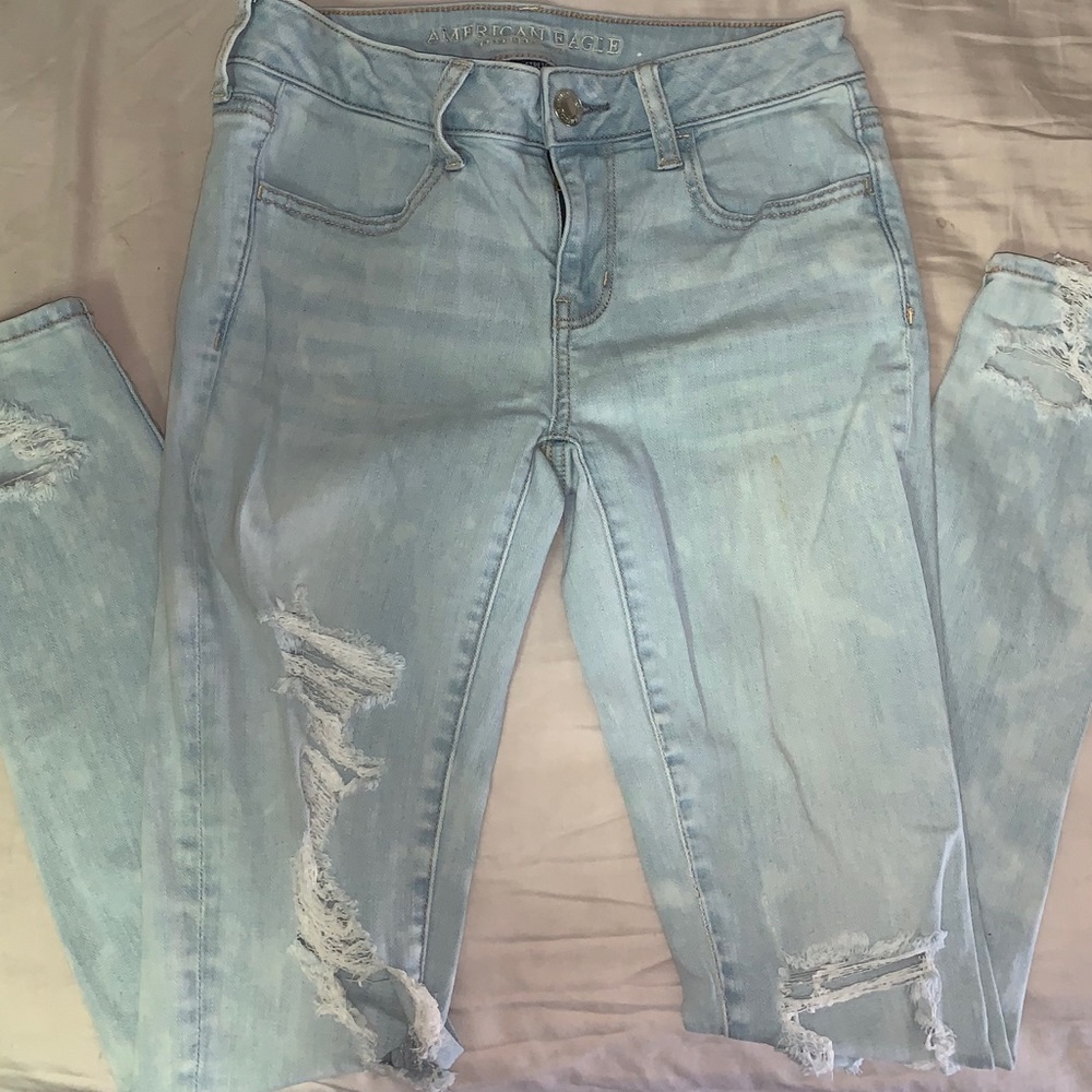 Bleach splattered light wash ripped skinny jeans